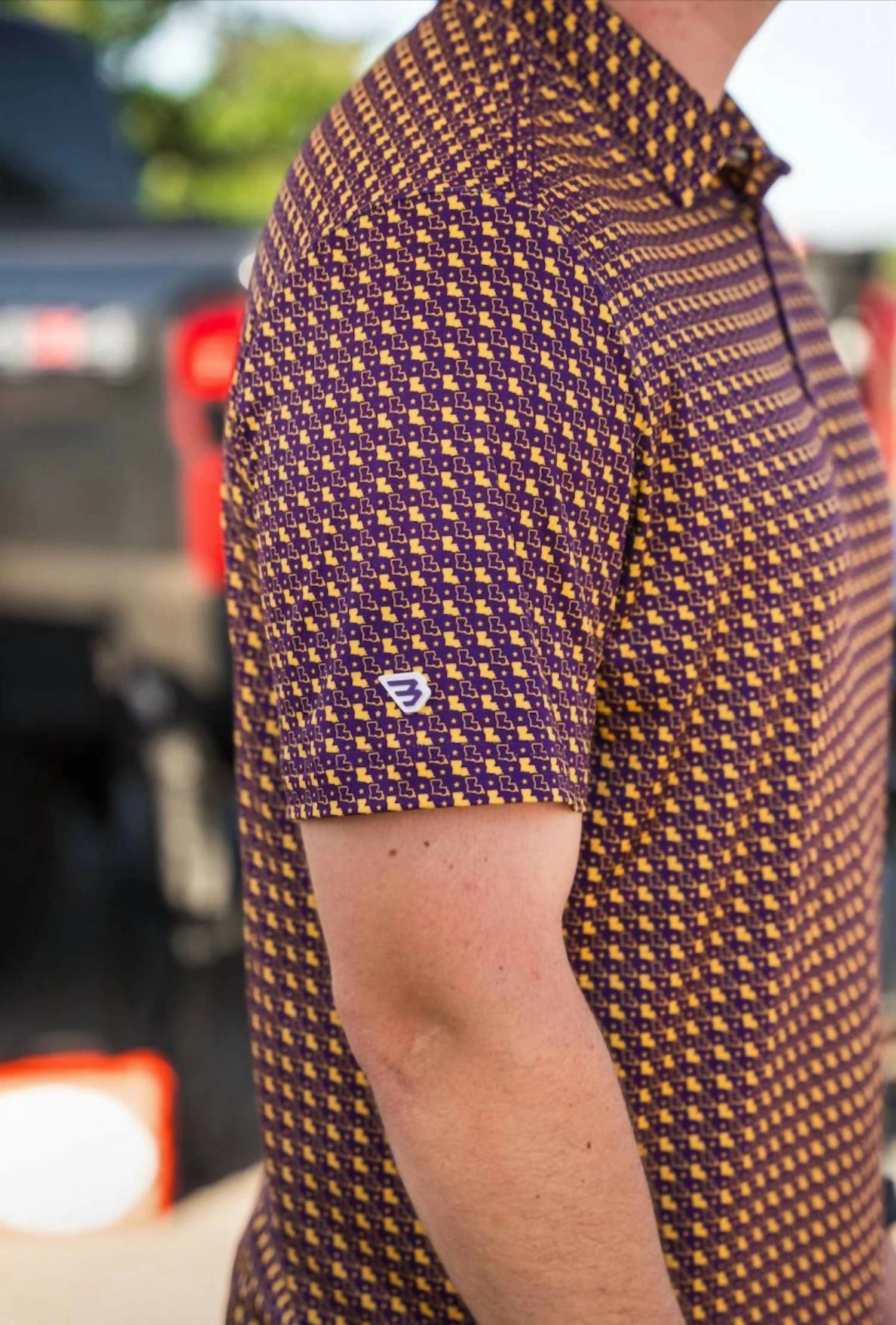 Performance Polo In Louisiana Purple And Yellow